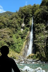NEW ZEALAND Thunder Creek Falls man silhouette
